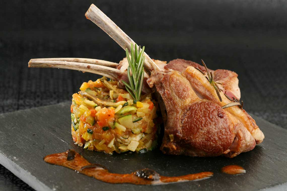 Easter rack of lamb with Provençal vegetables and red pepper drizzle